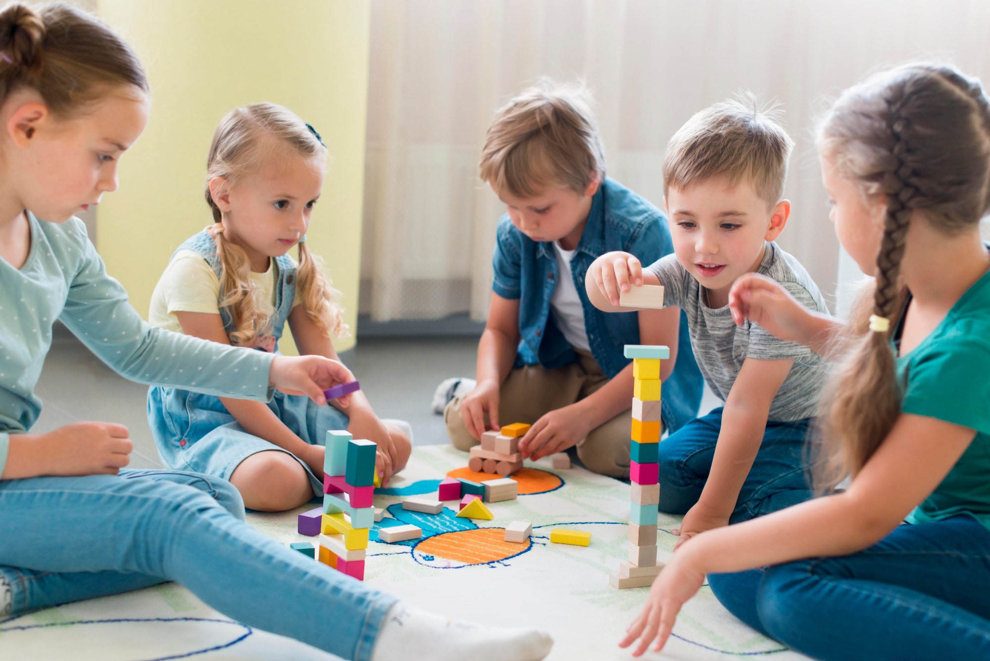 A group of children playing and learning at a preschool and daycare in Bellandur.